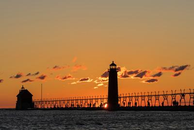 Sunset Silhouettes the Grand Haven Lighthouse in Grand Haven, Michigan, Usa