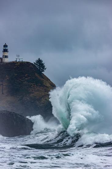 Waves crash below lighthouse at Cape Disappointment State Park