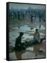 Chuck Morgan Sitting in the Mud and Water with a Friend, During Woodstock Music and Art Fair-John Dominis-Framed Stretched Canvas