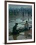 Chuck Morgan Sitting in the Mud and Water with a Friend, During Woodstock Music and Art Fair-John Dominis-Framed Photographic Print