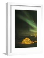 Churchill, Manitoba, Canada. Northern Lights shine above lit igloo.-Yvette Cardozo-Framed Photographic Print