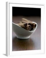 Cinnamon Sticks in Small Bowl-Henrik Freek-Framed Photographic Print