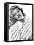 circa, 1942: Portrait of American actor Rita Hayworth (1918 - 1987) wearing a striped shirt (b/w ph-null-Framed Stretched Canvas