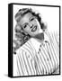 circa, 1942: Portrait of American actor Rita Hayworth (1918 - 1987) wearing a striped shirt (b/w ph-null-Framed Stretched Canvas