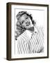 circa, 1942: Portrait of American actor Rita Hayworth (1918 - 1987) wearing a striped shirt (b/w ph-null-Framed Photo