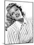 circa, 1942: Portrait of American actor Rita Hayworth (1918 - 1987) wearing a striped shirt (b/w ph-null-Mounted Photo