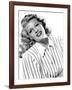 circa, 1942: Portrait of American actor Rita Hayworth (1918 - 1987) wearing a striped shirt (b/w ph-null-Framed Photo