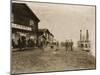 Circle City Saloon At The Docks Of Nome With Steamship-null-Mounted Art Print