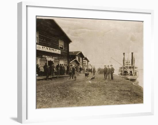 Circle City Saloon At The Docks Of Nome With Steamship-null-Framed Art Print