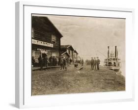 Circle City Saloon At The Docks Of Nome With Steamship-null-Framed Art Print