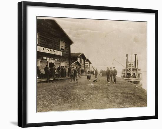Circle City Saloon At The Docks Of Nome With Steamship-null-Framed Art Print