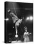 Circus Performer Balancer Unus Standing on His Index Finger on Globe Feet in Air Back of Head-Ralph Morse-Stretched Canvas