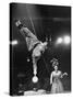 Circus Performer Balancer Unus Standing on His Index Finger on Globe Feet in Air Back of Head-Ralph Morse-Stretched Canvas