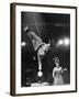 Circus Performer Balancer Unus Standing on His Index Finger on Globe Feet in Air Back of Head-Ralph Morse-Framed Photographic Print