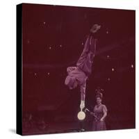 Circus Performer Balancing on Forefinger-Ralph Morse-Stretched Canvas