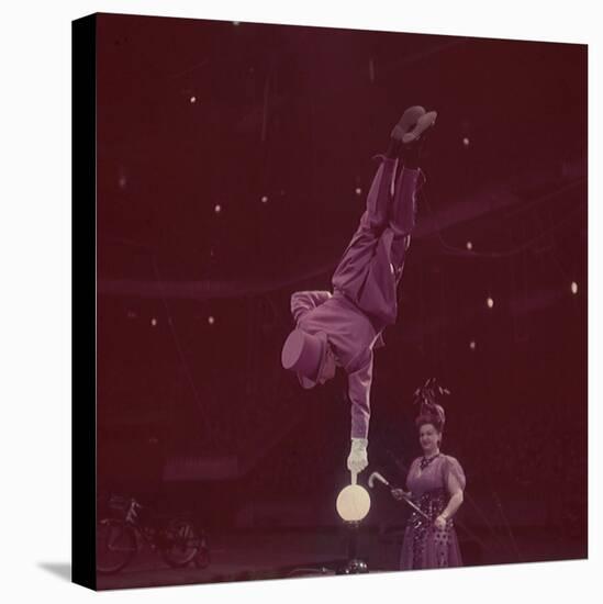 Circus Performer Balancing on Forefinger-Ralph Morse-Stretched Canvas