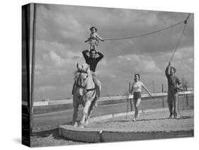 Circus Performers Practicing Stunt-Cornell Capa-Stretched Canvas