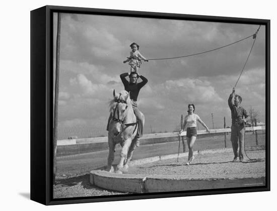 Circus Performers Practicing Stunt-Cornell Capa-Framed Stretched Canvas