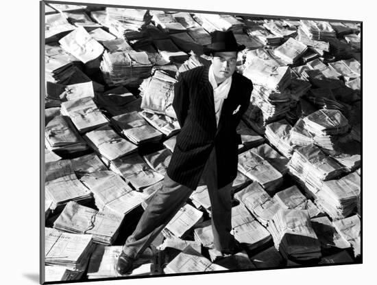 Citizen Kane, Orson Welles, 1941, Astride Stacks Of Newspaper-null-Mounted Photo