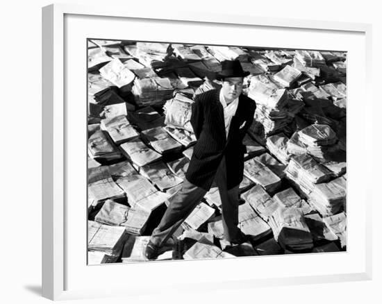 Citizen Kane, Orson Welles, 1941, Astride Stacks Of Newspaper-null-Framed Photo