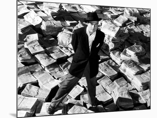 Citizen Kane, Orson Welles, 1941, Astride Stacks Of Newspaper-null-Mounted Photo