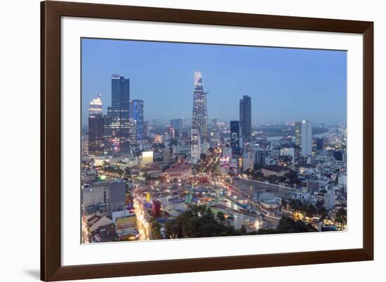 City skyline at night showing the Bitexco tower, Ho Chi Minh City (Saigon), Vietnam, Indochina, Sou-Alex Robinson-Framed Photographic Print