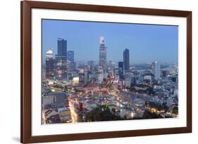 City skyline at night showing the Bitexco tower, Ho Chi Minh City (Saigon), Vietnam, Indochina, Sou-Alex Robinson-Framed Photographic Print