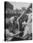 Civilian Receiving a Blood Transfusion from the British Red Cross Setup in a Tent-Allan Grant-Stretched Canvas