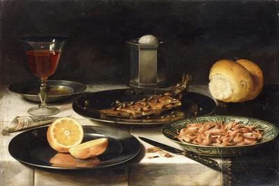 A Herring with Capers and a Sliced Orange on Plates and a Bowl of Shrimp on a Table