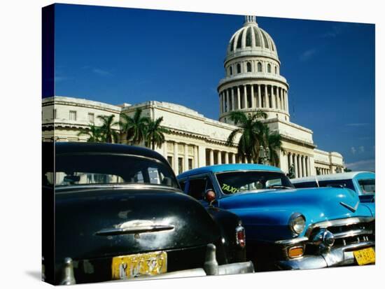 Classic American Taxi Cars Parked in Front of National Capital Building, Havana, Cuba-Martin Lladó-Stretched Canvas