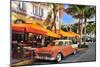 Classic Car in front of the Paparazzi Restaurant, Ocean Drive-null-Mounted Art Print