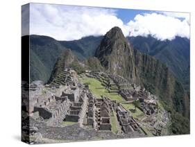 Classic View from Funerary Rock of Inca Town Site, Machu Picchu, Unesco World Heritage Site, Peru-Tony Waltham-Stretched Canvas