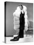 Claudette Colbert, in Travis Banton Gown and White Fox Fur Coat, c.1935-null-Stretched Canvas