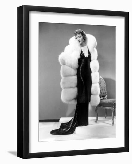 Claudette Colbert, in Travis Banton Gown and White Fox Fur Coat, c.1935-null-Framed Photo