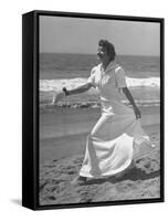 Claudette Colbert in Zippered, Terry Cloth Beach Robe, Sashaying Along Surf at Santa Monica Beach-Peter Stackpole-Framed Stretched Canvas