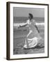 Claudette Colbert in Zippered, Terry Cloth Beach Robe, Sashaying Along Surf at Santa Monica Beach-Peter Stackpole-Framed Premium Photographic Print