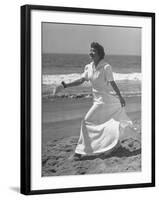 Claudette Colbert in Zippered, Terry Cloth Beach Robe, Sashaying Along Surf at Santa Monica Beach-Peter Stackpole-Framed Premium Photographic Print