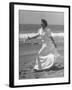 Claudette Colbert in Zippered, Terry Cloth Beach Robe, Sashaying Along Surf at Santa Monica Beach-Peter Stackpole-Framed Premium Photographic Print