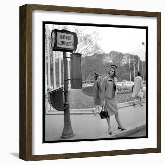 Claudia Cardinale Waiting Near the Champs-Elysées Roundabout, April 1964-Marcel Begoin-Framed Photographic Print