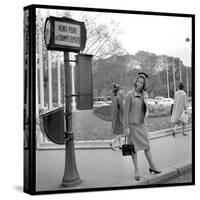 Claudia Cardinale Waiting Near the Champs-Elysées Roundabout, April 1964-Marcel Begoin-Stretched Canvas
