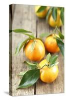 Clementines with Leaves on Wood-Nikky-Stretched Canvas