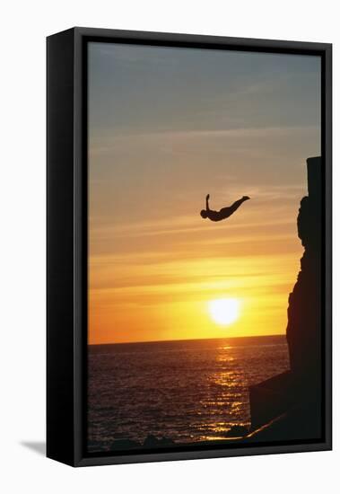 Cliff Diver above Setting Sun-Bob Krist-Framed Stretched Canvas