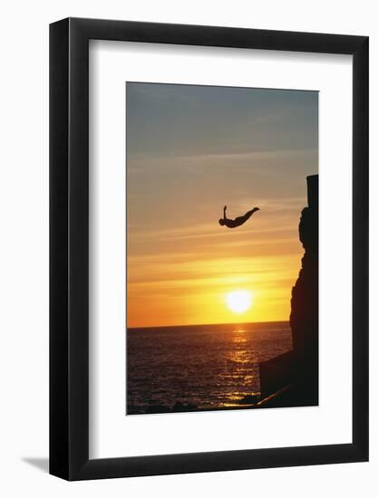 Cliff Diver above Setting Sun-Bob Krist-Framed Photographic Print