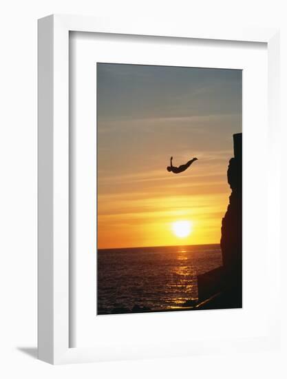 Cliff Diver above Setting Sun-Bob Krist-Framed Photographic Print