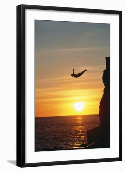 Cliff Diver above Setting Sun-Bob Krist-Framed Photographic Print