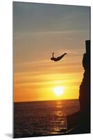 Cliff Diver above Setting Sun-Bob Krist-Mounted Photographic Print