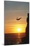 Cliff Diver above Setting Sun-Bob Krist-Mounted Photographic Print