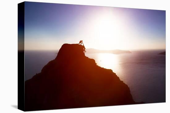 Climber Giving Hand and Helping His Friend to Reach the Top of the Mountain. Help, Support, Assista-Michal Bednarek-Stretched Canvas