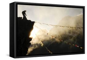 Climber on Kala Pattar Peak (5545M) with Buddhist Prayer Flags at Sunset, Nepal, Himalaya-Enrique Lopez-Tapia-Framed Stretched Canvas