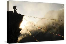 Climber on Kala Pattar Peak (5545M) with Buddhist Prayer Flags at Sunset, Nepal, Himalaya-Enrique Lopez-Tapia-Stretched Canvas